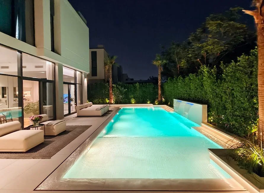 Pool finishes illuminated at night