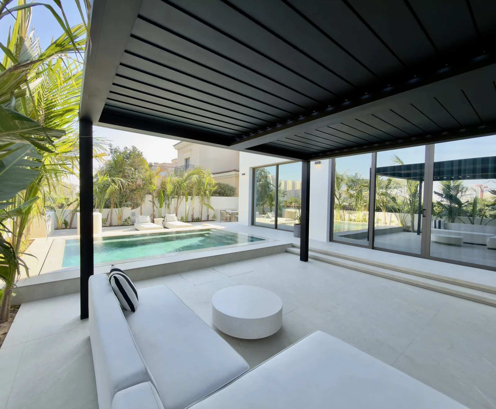 Poolside pergola with shaded outdoor seating